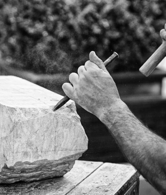 Carving stone, craftsman shaping stone, art and crafts